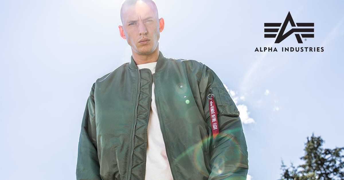 a man wearing an Alpha Industries jacket
