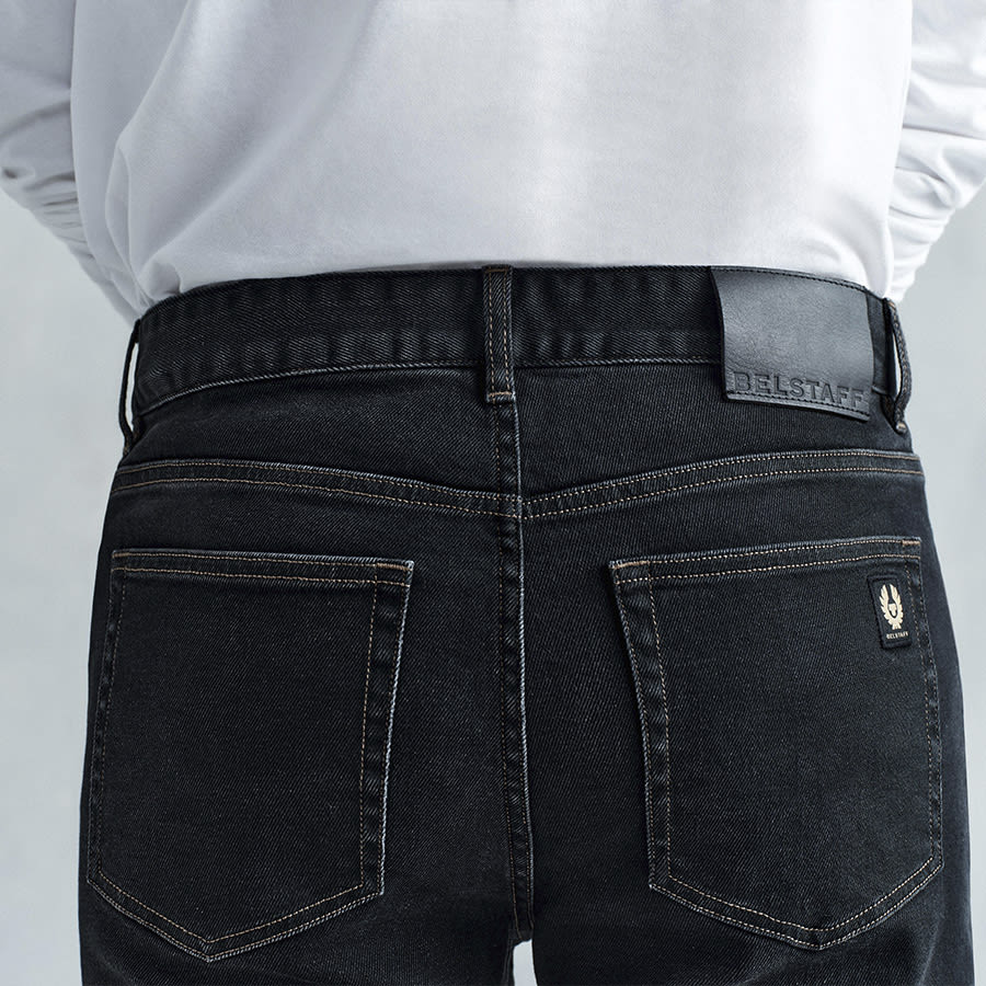 A man pictured from behind wearing Belstaff jeans