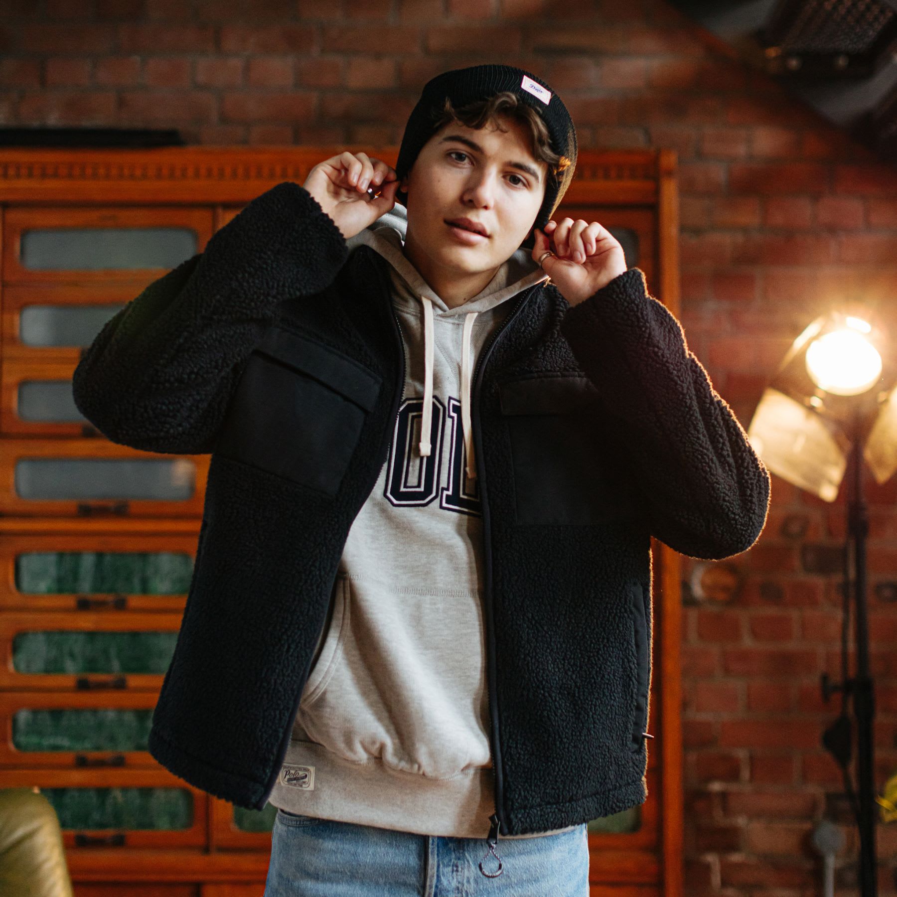 A man wearing a fleece jacket and matching hat