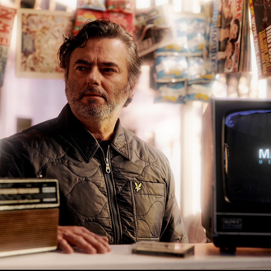 A man dressed in a Lyle & Scott jacket