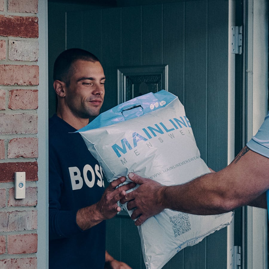 A man receives a delivery from Mainline