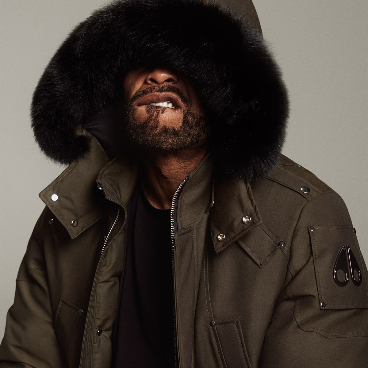 A man in a Moose Knuckles jacket