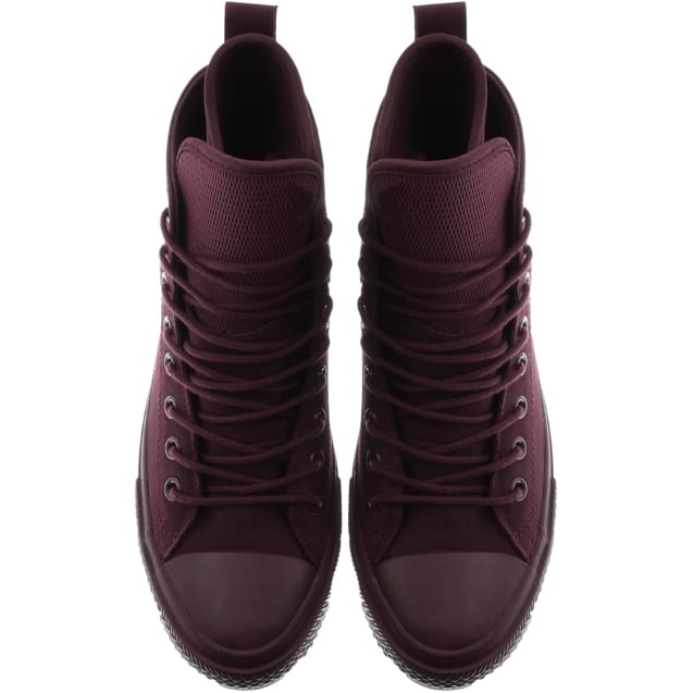 Purple boots with busy lacing