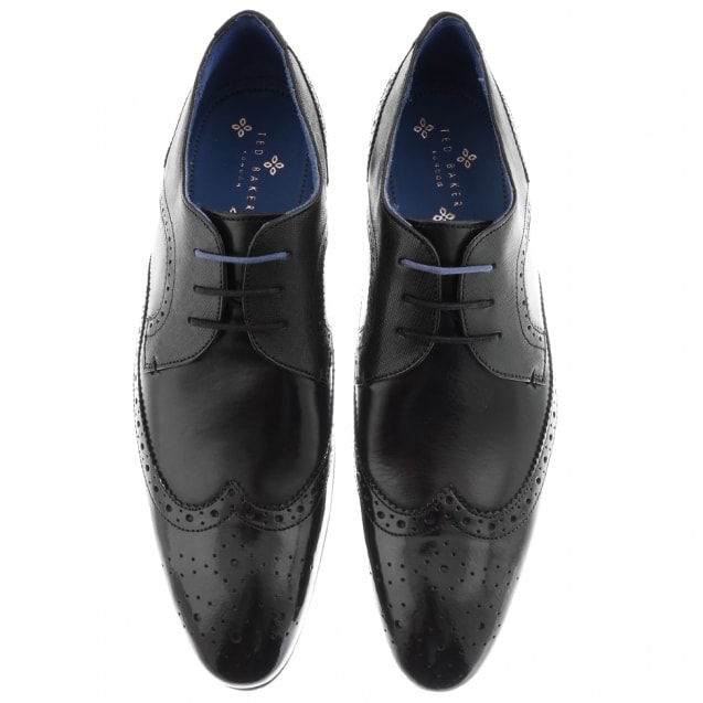 Black brogues laced in a straight through style.