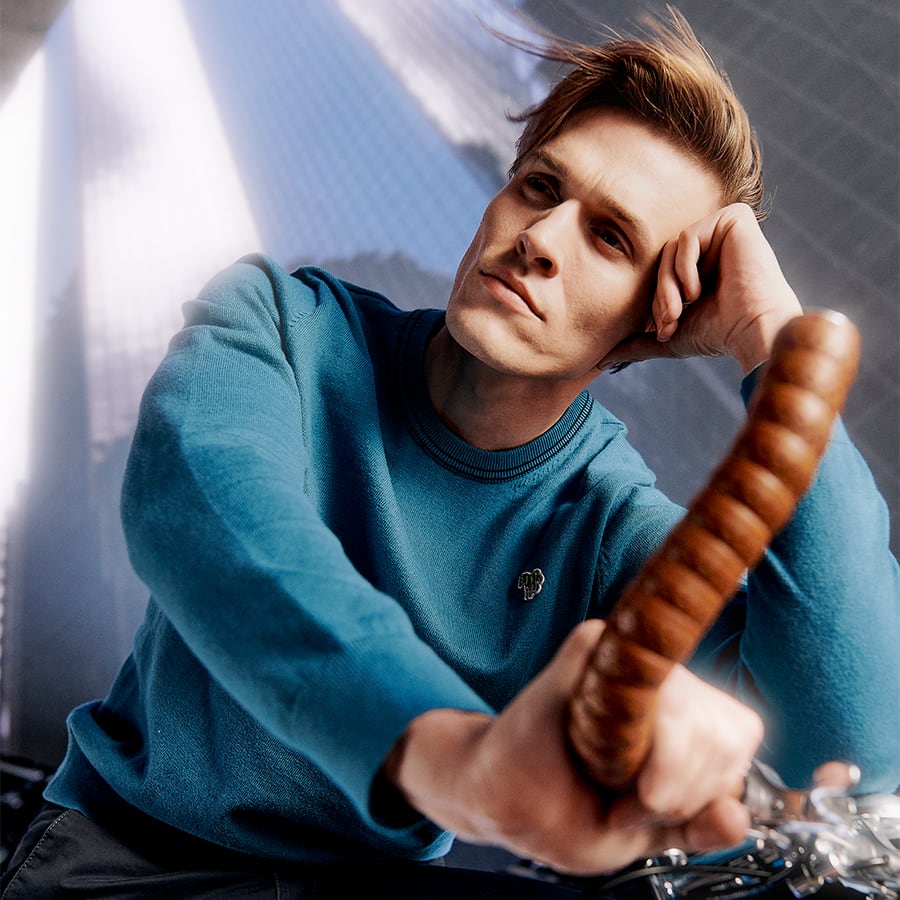 A man wearing a blue sweatshirt