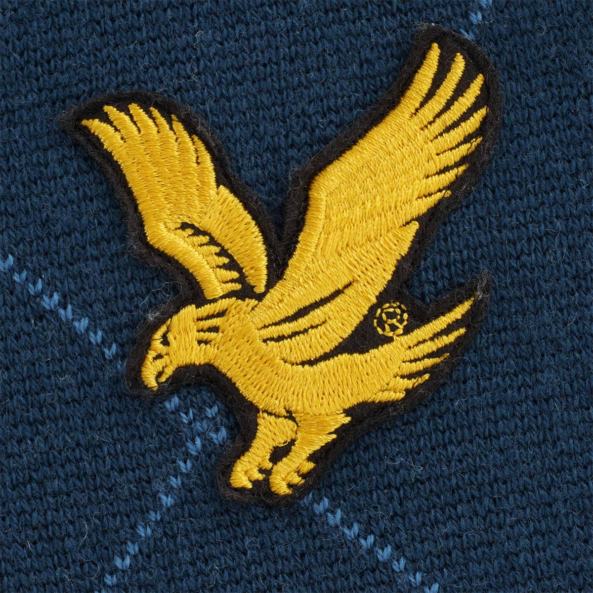 The famous Lyle & Scott knitwear logo - a golden eagle in flight