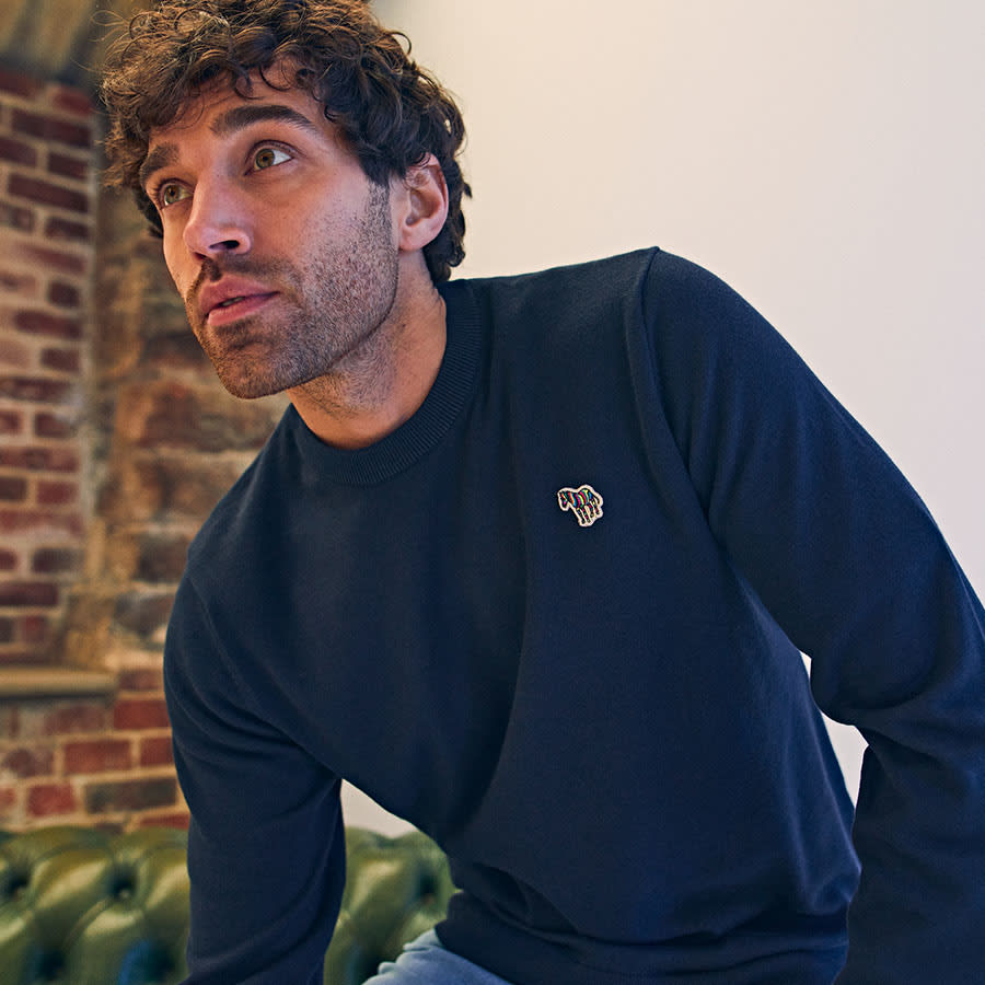 A man wearing a Paul Smith jumper