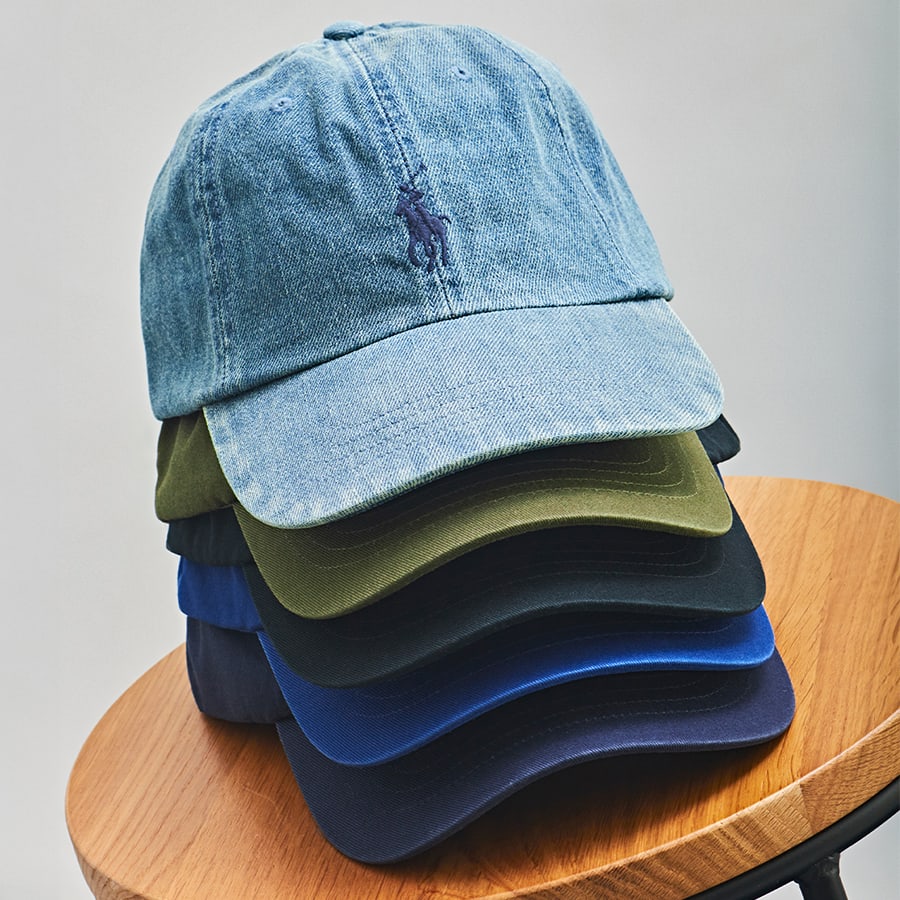 A stack of designer baseball caps