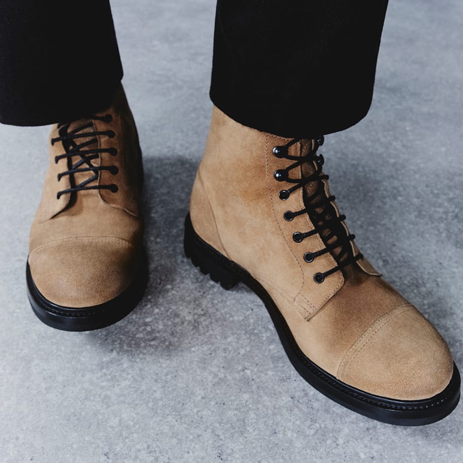 A pair of brown Belstaff x Grenson boots