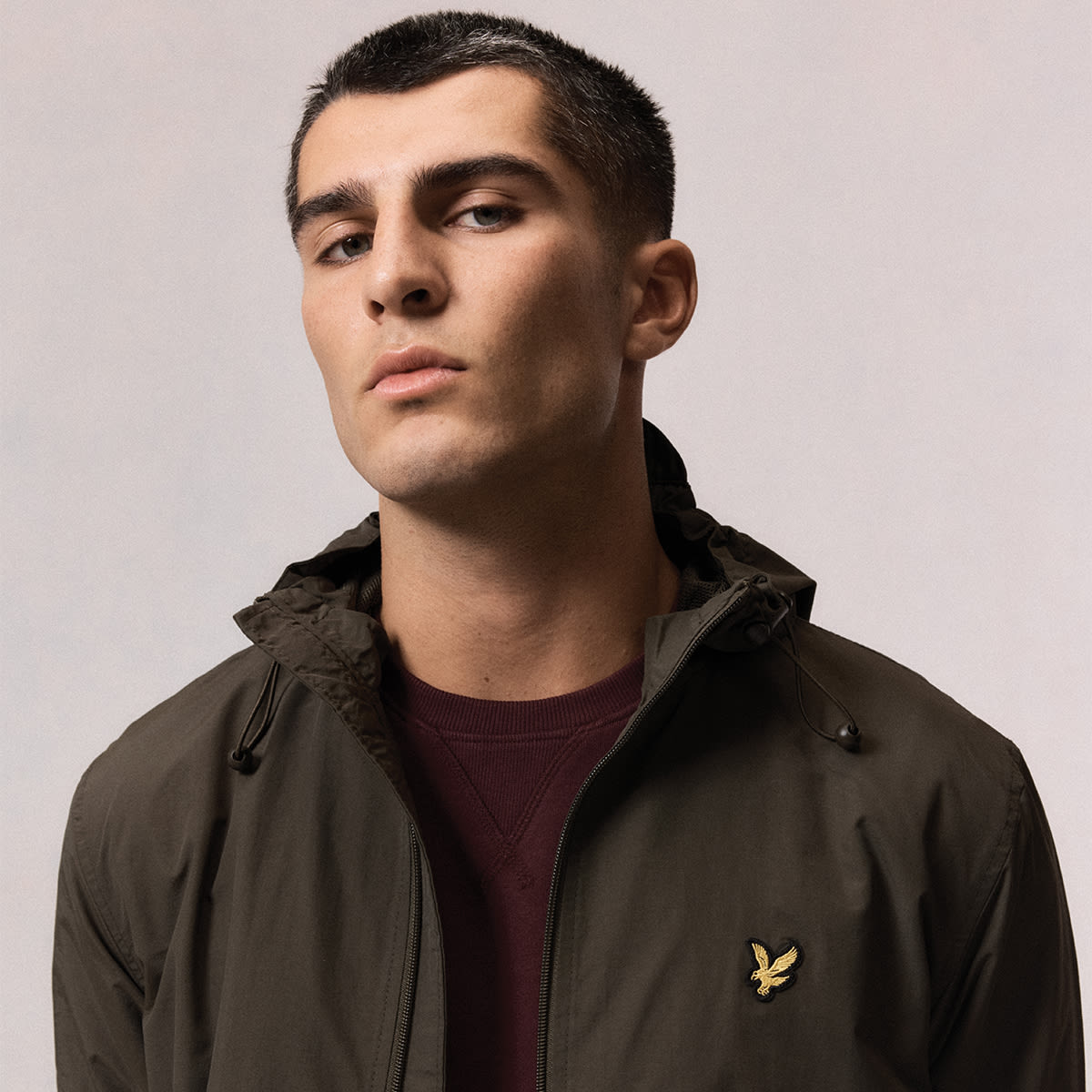 A man wearing Lyle & Scott looking at the camera
