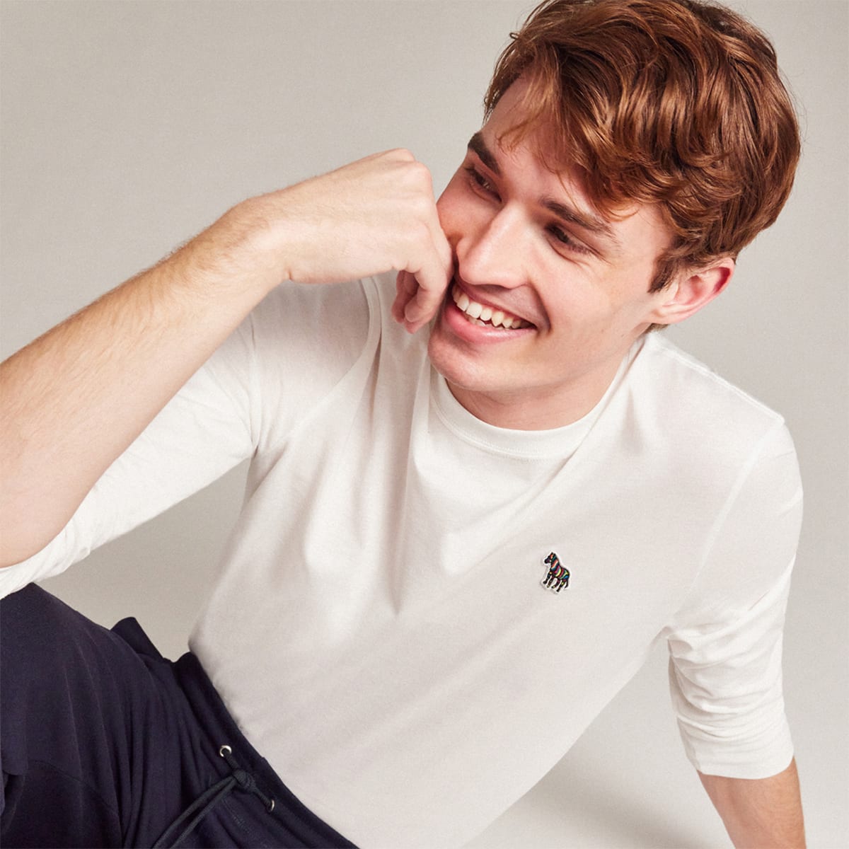 A man wearing a Paul Smith T shirt