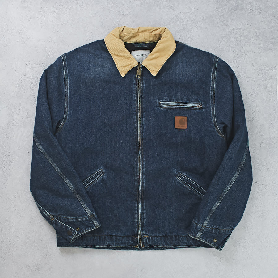 A blue denim jacket with a furry collar