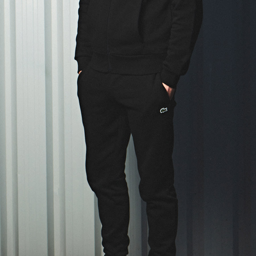 A man wearing designer joggers