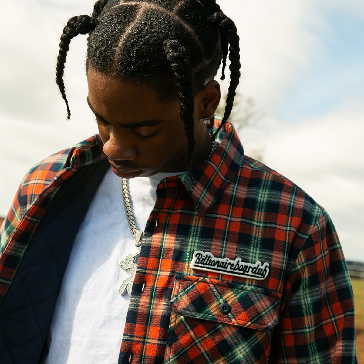 A young man dressed in Billionaire Boys Club clothes