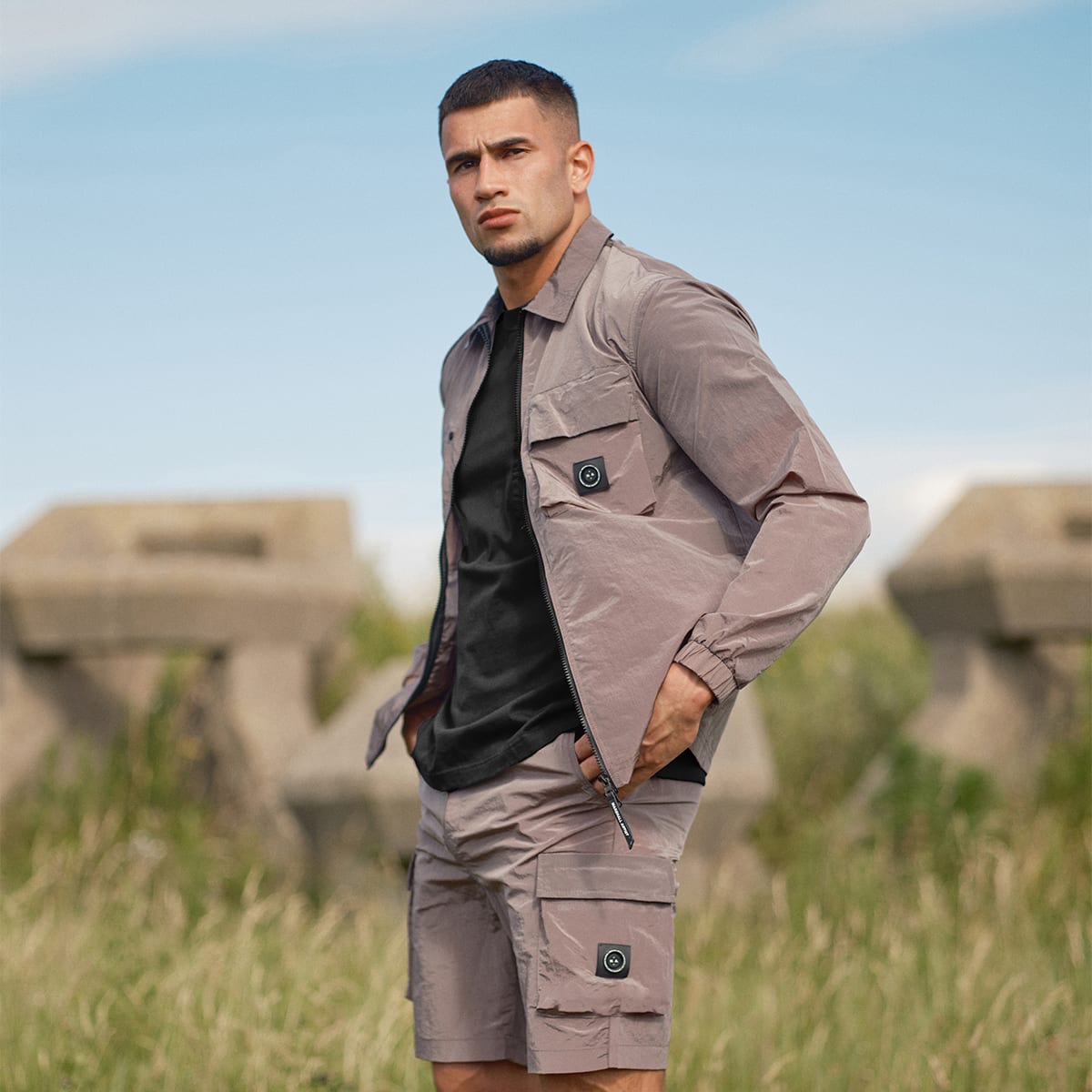 A man poses in Marshall Artist clothes