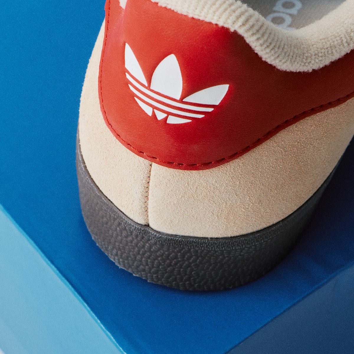 The back of a red and white adidas trainer