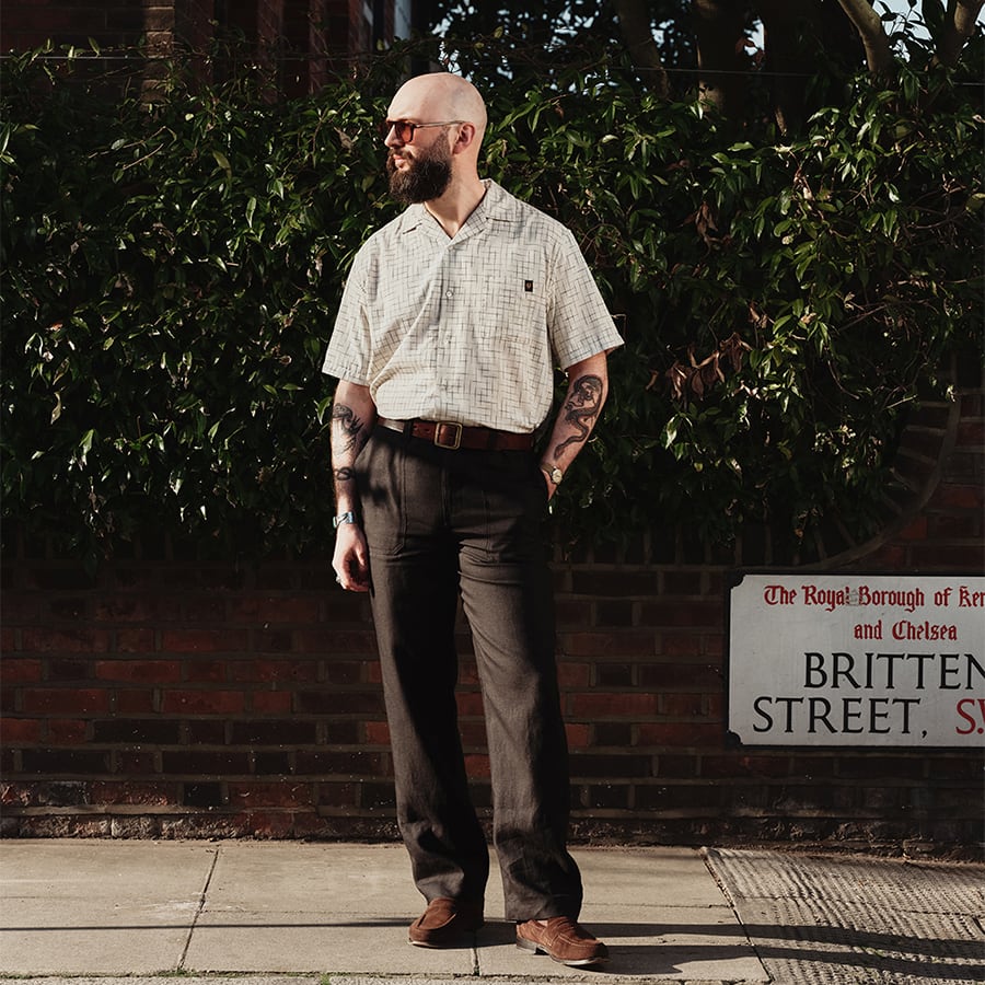 A man standing in the street dressed in Belstaff clothing