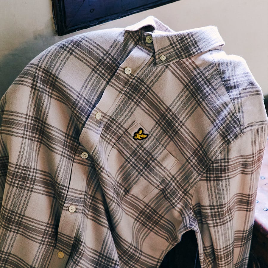 A checked shirt with a button down collar