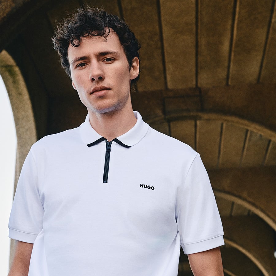 A young man dressed in a polo shirt