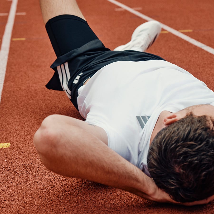 A runner cooling down after a race at the track
