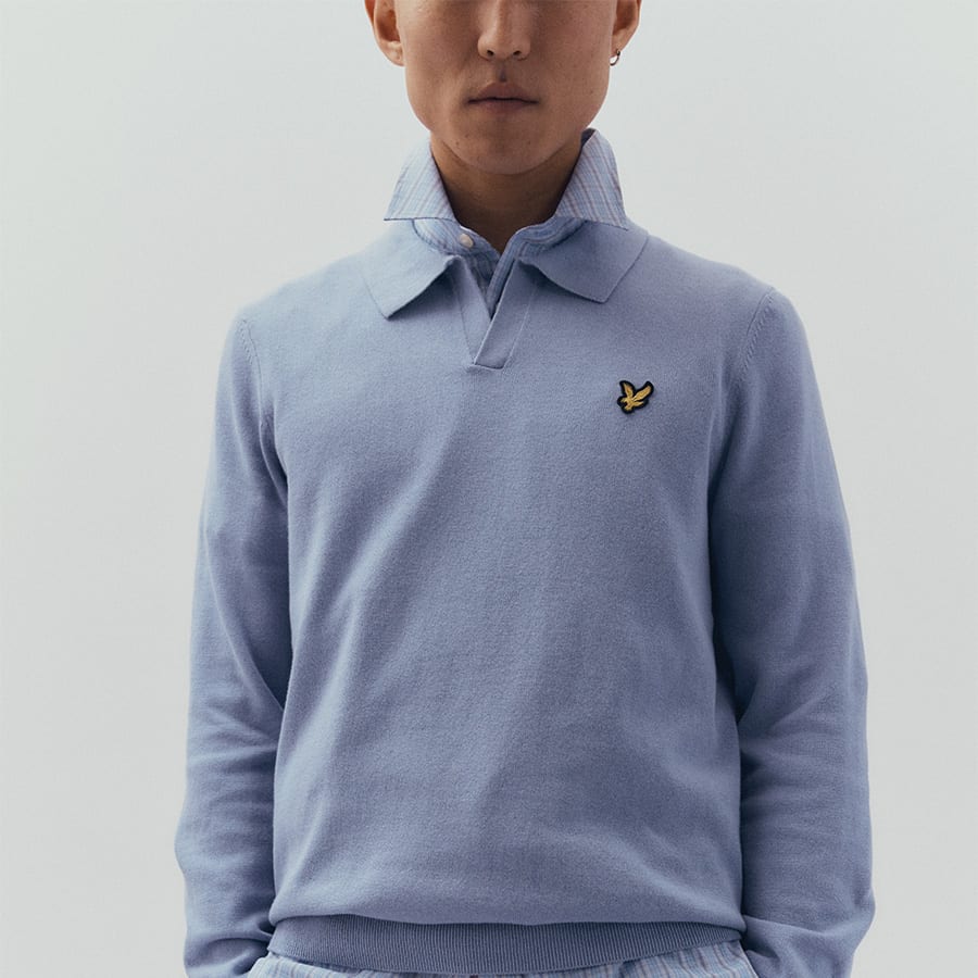 A man wearing a light blue jumper from Lyle & Scott
