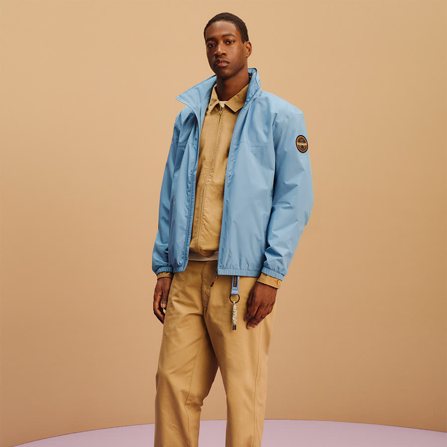 A man wearing Napapijri clothes stands casually