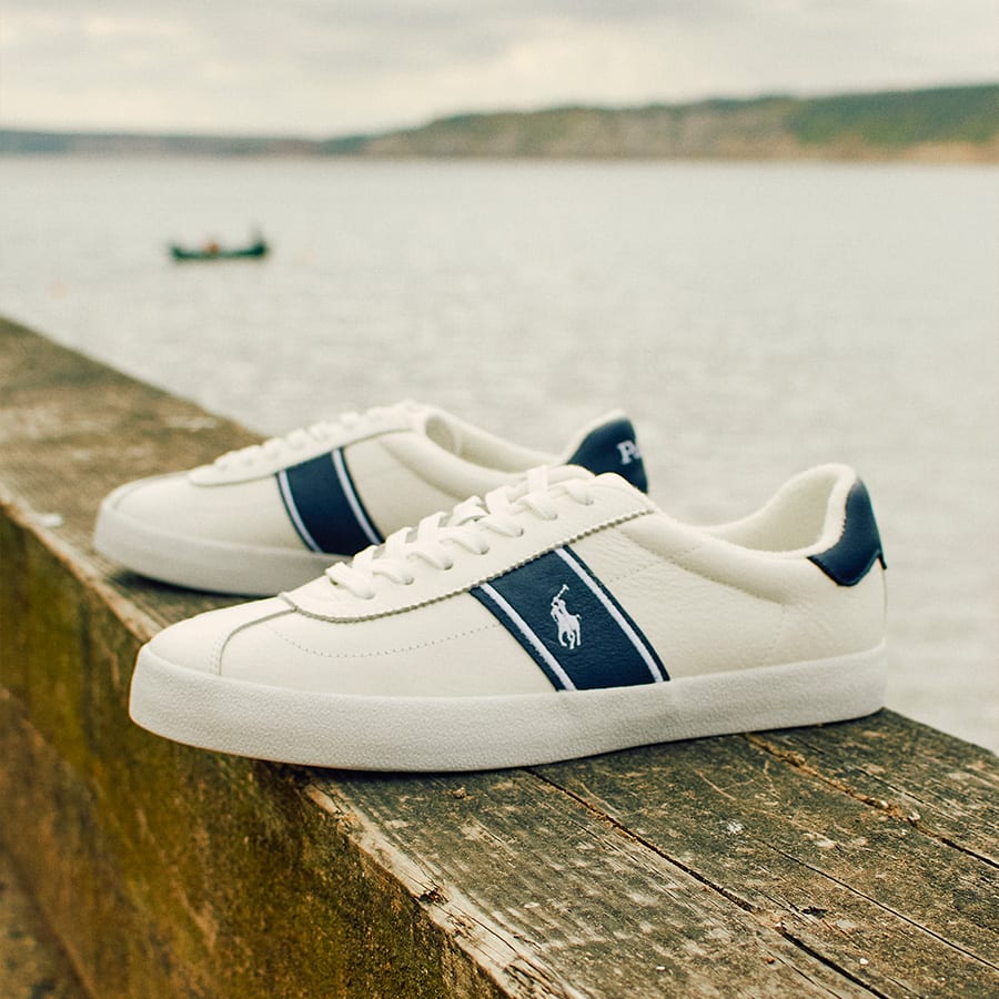 A pair of Ralph Lauren trainers on the sea wall