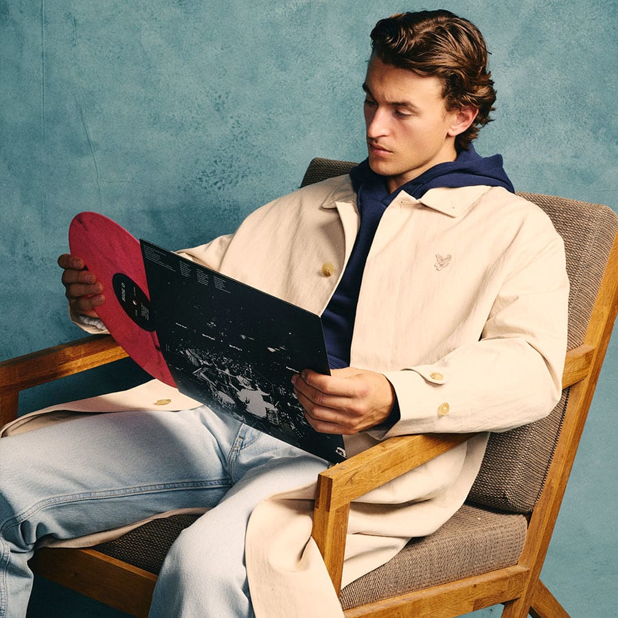 A man taking a record out of its sleeve