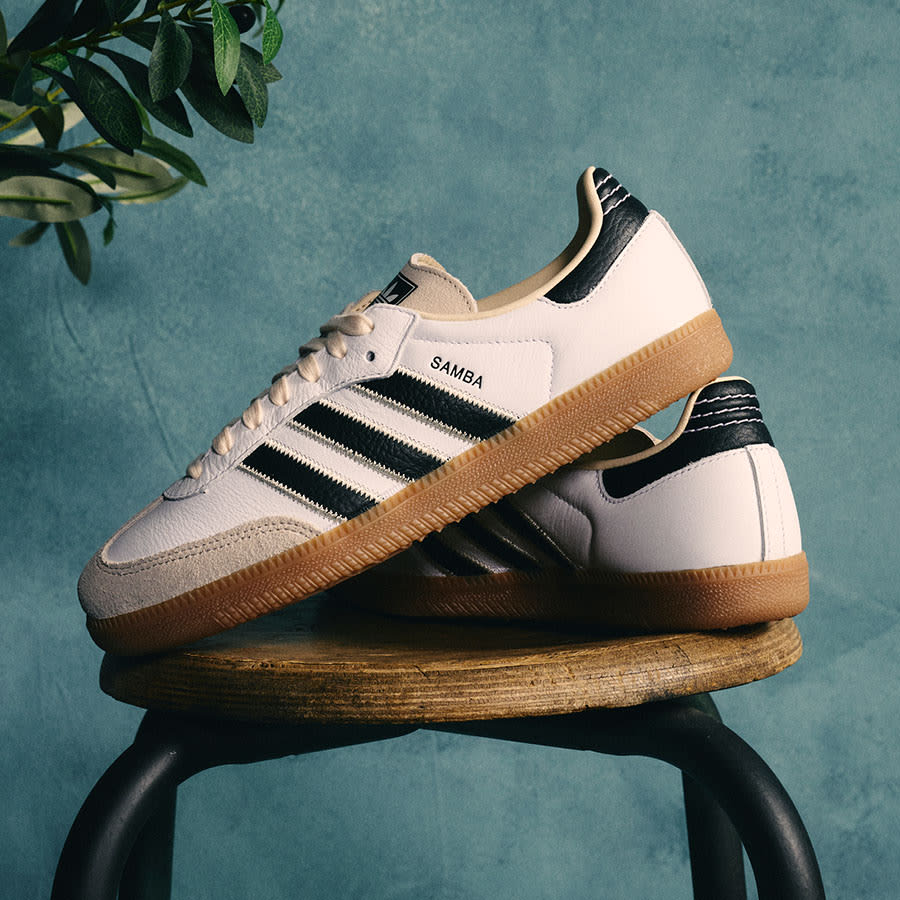 A pair of adidas Samba trainers on a stool