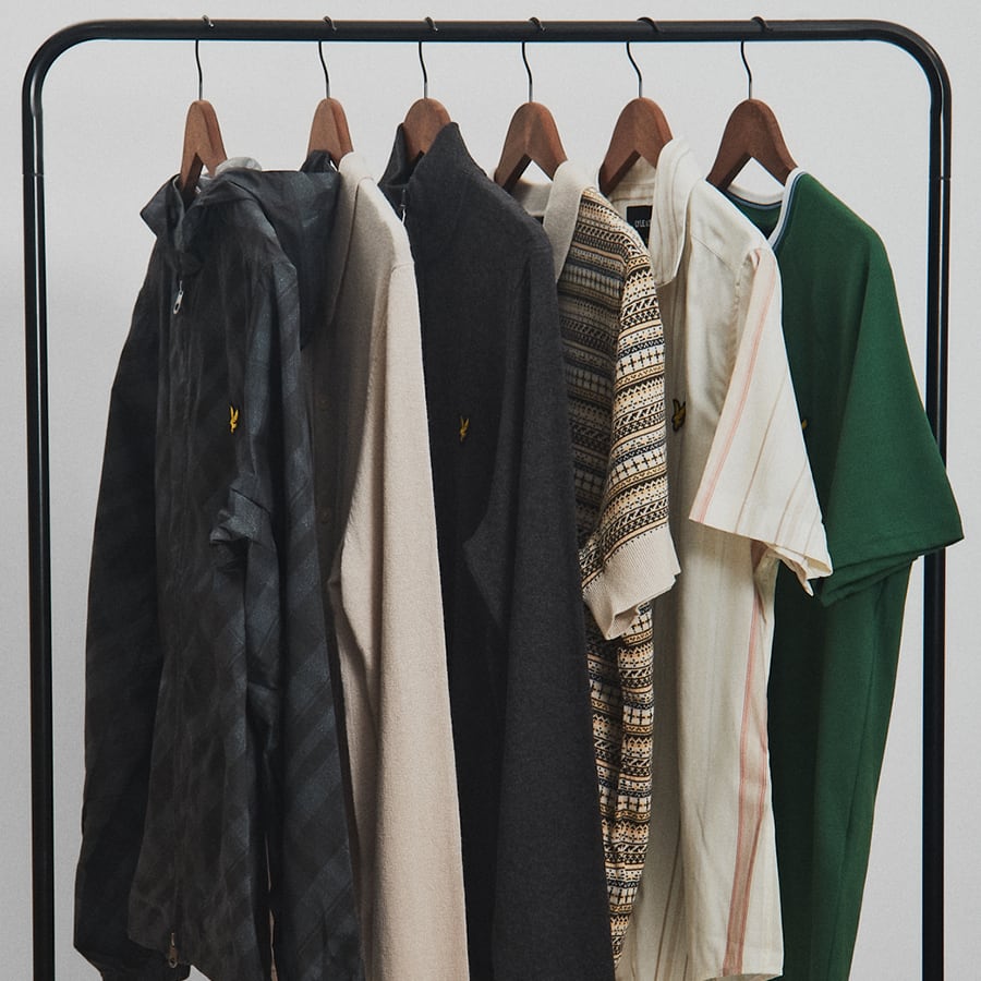 A selection of Lyle & Scott clothing on a hanging rail