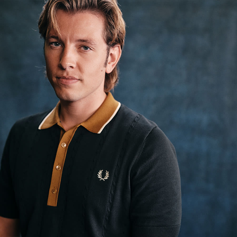 Charlie wearing Fred Perry