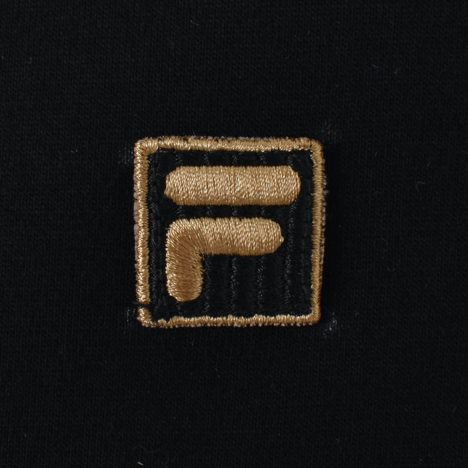 Black and gold fila shirt shop