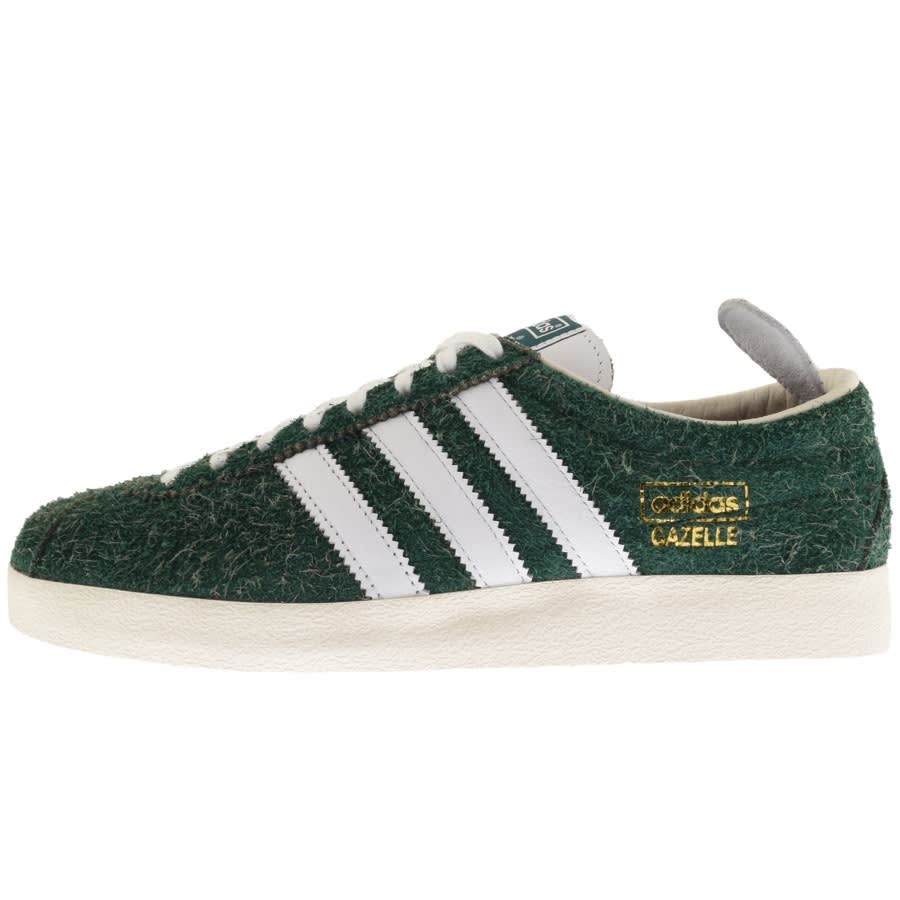 green and white adidas trainers